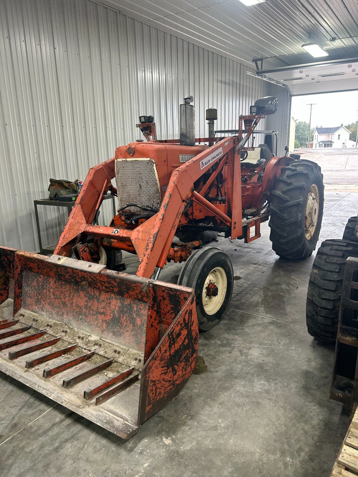 Allis-Chalmers D17 tractor, front loader and bucket view