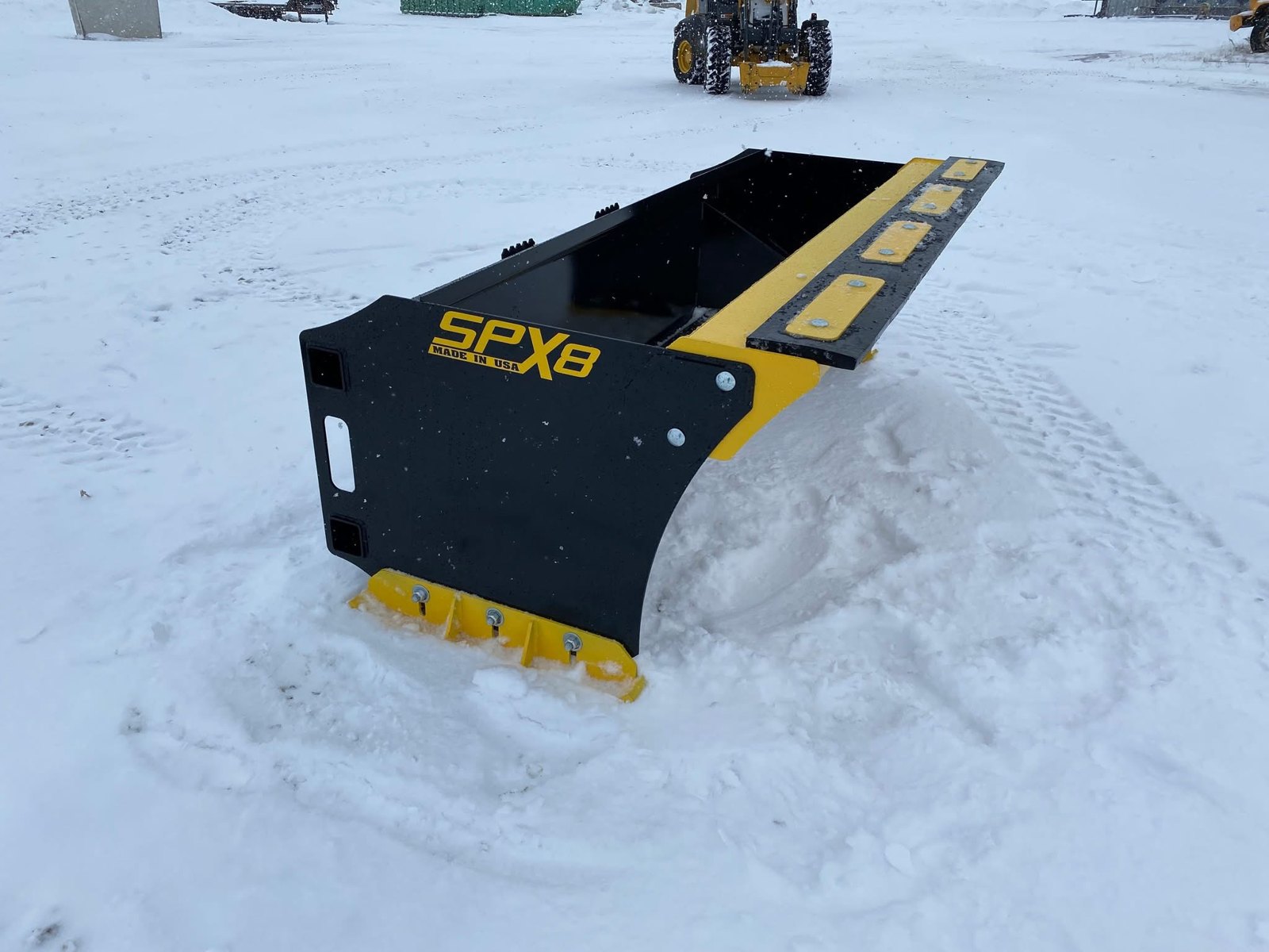 Stinger SPX8 snow pusher with dragback, angled side view